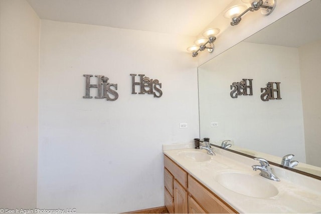 full bath with double vanity and a sink