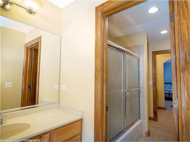 bathroom featuring tile patterned flooring, recessed lighting, shower / bath combination with glass door, and vanity