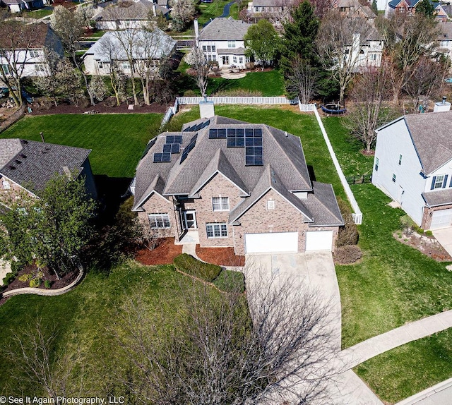 birds eye view of property with a residential view