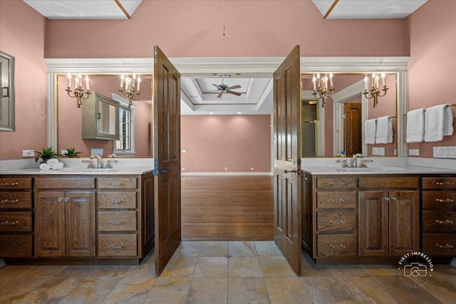 full bathroom featuring ceiling fan, two vanities, and a sink