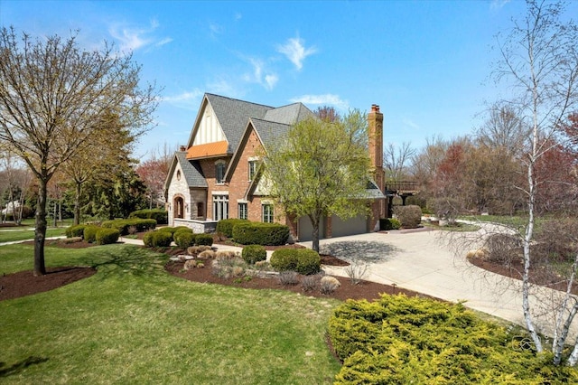 view of side of home featuring concrete driveway, a yard, stone siding, and a garage