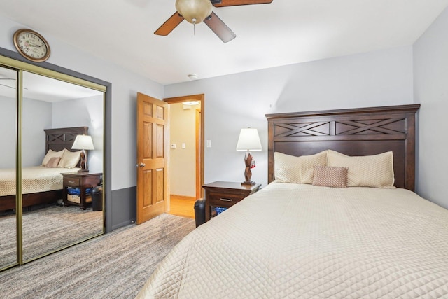 bedroom featuring a ceiling fan, carpet floors, and a closet