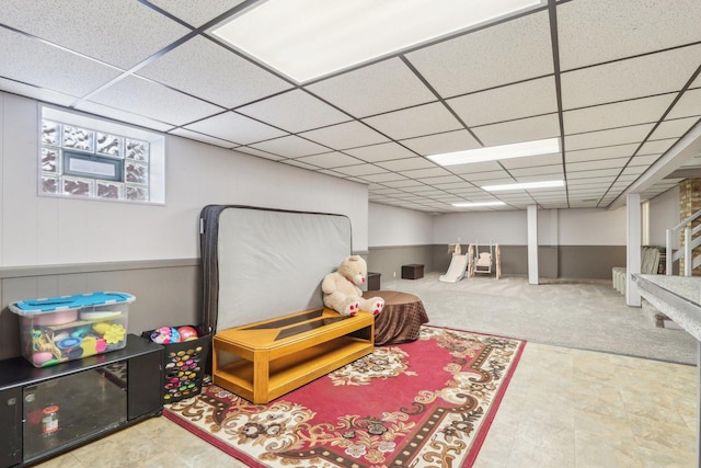 game room featuring a drop ceiling and carpet floors