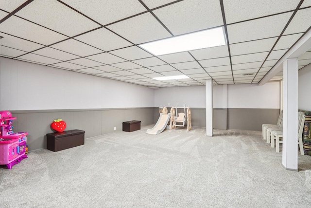 rec room with a drop ceiling and carpet floors