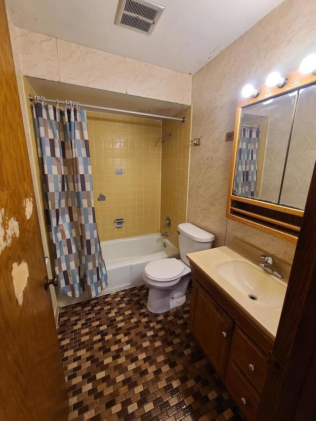 full bathroom with vanity, shower / bathtub combination with curtain, visible vents, and toilet