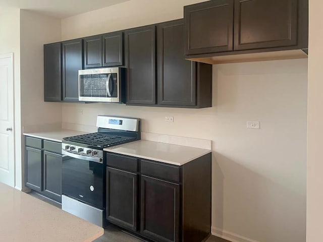 279 Charlestowne Lakes Dr, Saint Charles, IL 60174 - kitchen with light countertops, baseboards, and stainless steel appliances