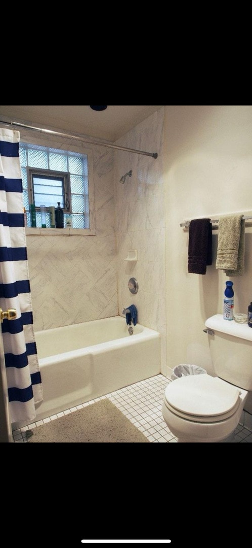 2742 N Kenmore Ave, Chicago, IL 60614 - full bathroom with tile patterned floors, shower / bath combination with curtain, and toilet