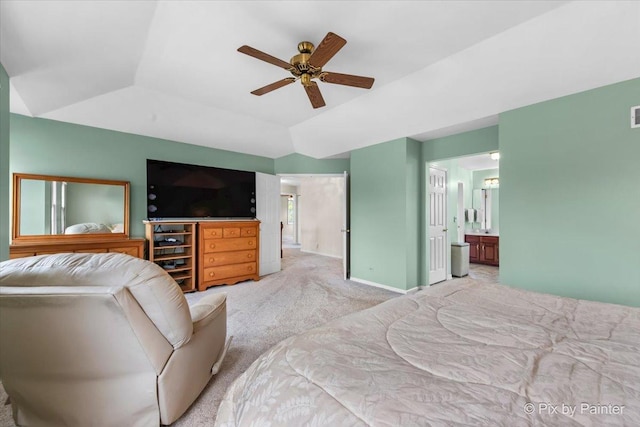 bedroom featuring baseboards, a ceiling fan, light colored carpet, and ensuite bathroom