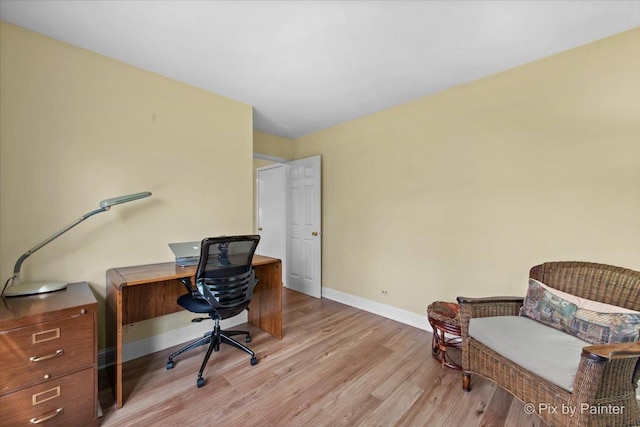 office featuring light wood finished floors and baseboards