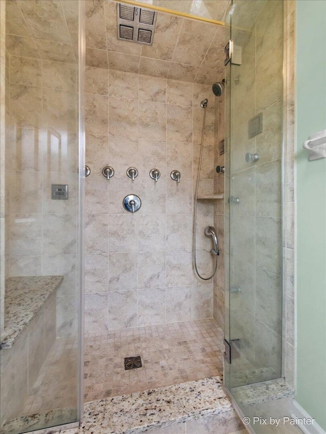 bathroom with a stall shower