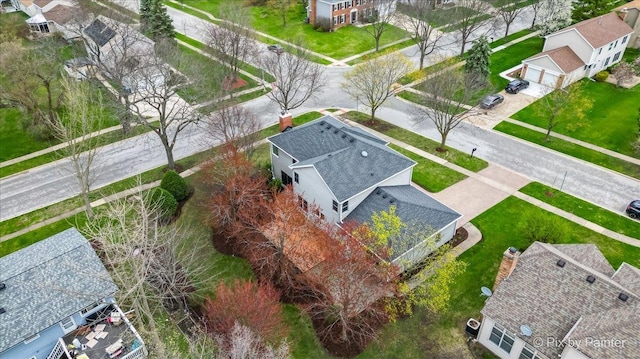 birds eye view of property with a residential view