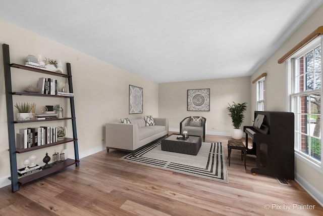 living room with wood finished floors and baseboards
