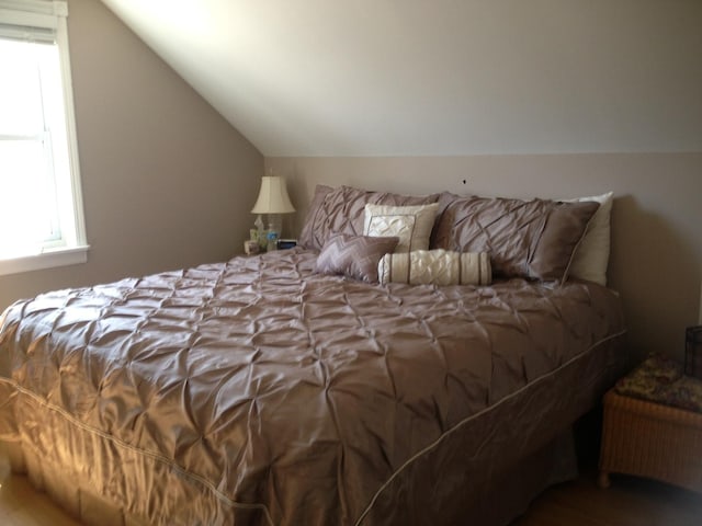 bedroom with lofted ceiling