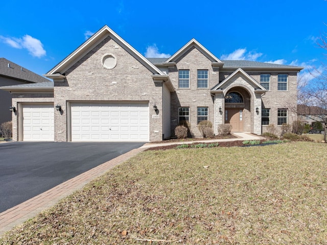 1866 Snead St, Bolingbrook, IL 60490 - traditional-style home with an attached garage, driveway, and brick siding