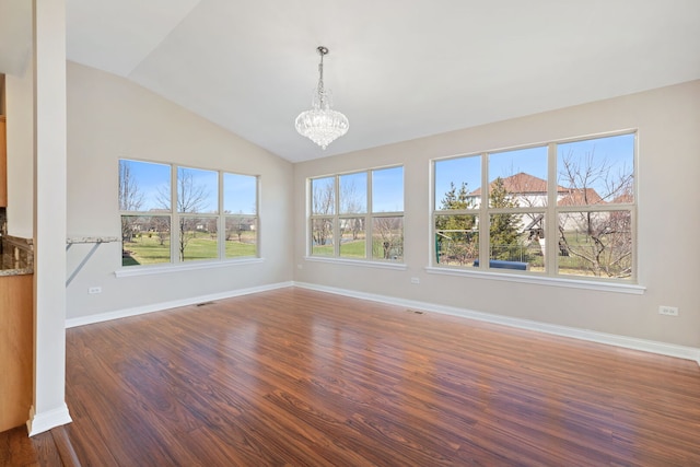 1866 Snead St, Bolingbrook, IL 60490 - unfurnished dining area featuring a healthy amount of sunlight, lofted ceiling, wood finished floors, and a chandelier