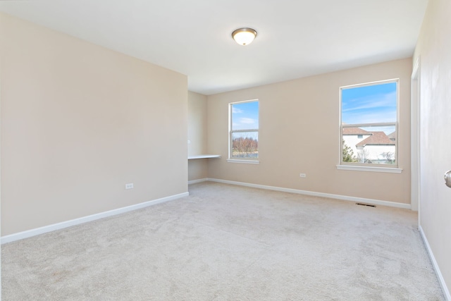 1866 Snead St, Bolingbrook, IL 60490 - empty room featuring carpet floors, visible vents, and a healthy amount of sunlight