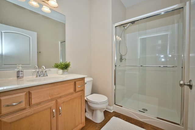 1866 Snead St, Bolingbrook, IL 60490 - bathroom featuring vanity, a stall shower, wood finished floors, and toilet