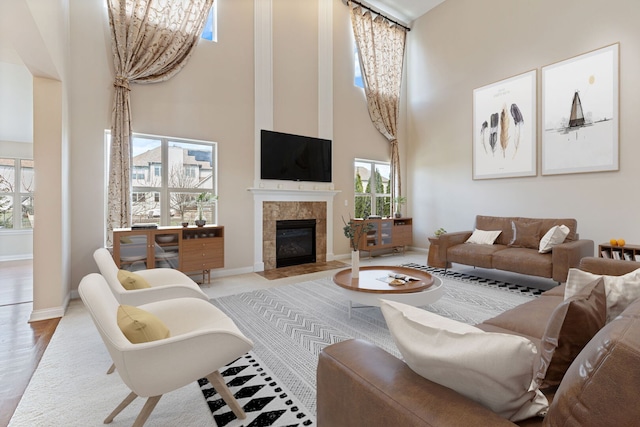 1866 Snead St, Bolingbrook, IL 60490 - living area featuring a high ceiling, a tiled fireplace, and baseboards