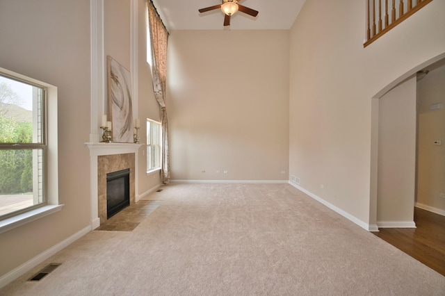 1866 Snead St, Bolingbrook, IL 60490 - unfurnished living room with plenty of natural light, ceiling fan, visible vents, and a high ceiling