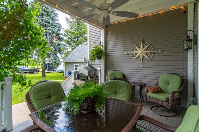 view of patio / terrace featuring a grill, outdoor dining area, and a ceiling fan