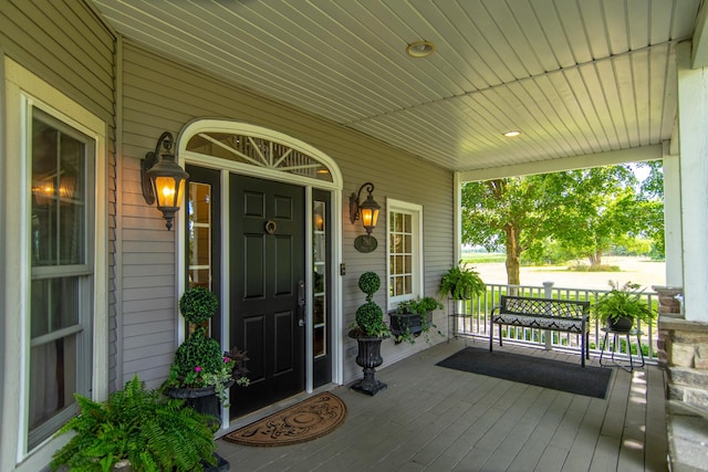 doorway to property with a porch