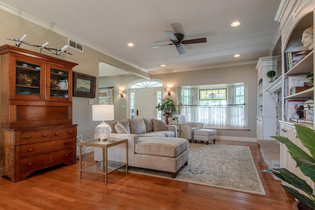 living area with recessed lighting, ceiling fan, light wood finished floors, baseboards, and visible vents