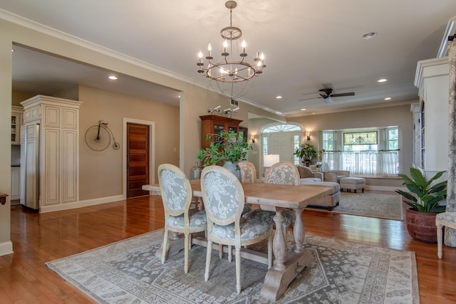 dining room featuring ornamental molding, baseboards, and light wood-type flooring