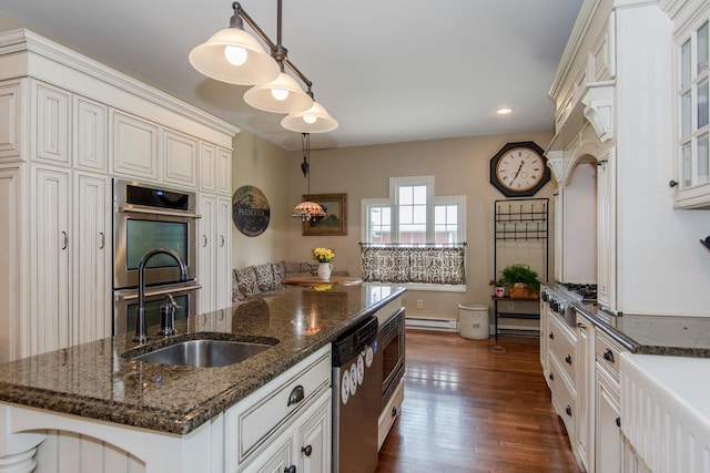 kitchen featuring dark wood-style floors, a kitchen island with sink, recessed lighting, appliances with stainless steel finishes, and a baseboard radiator