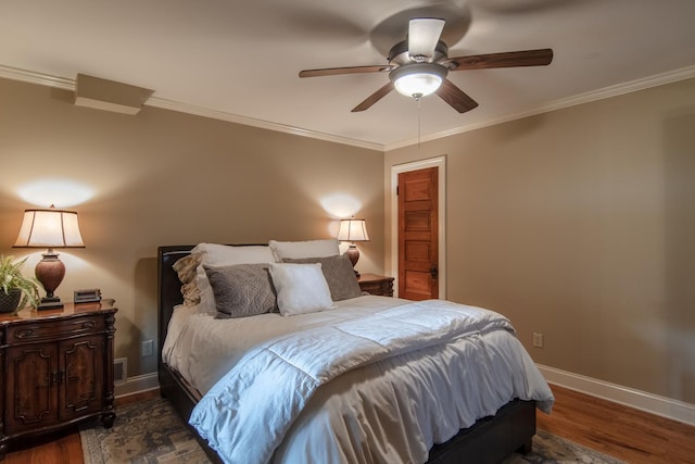 bedroom with wood finished floors, crown molding, a ceiling fan, and baseboards