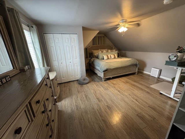 800 Tomahawk Trl, Round Lake Heights, IL 60073 - bedroom with vaulted ceiling, wood finished floors, a closet, ceiling fan, and baseboards