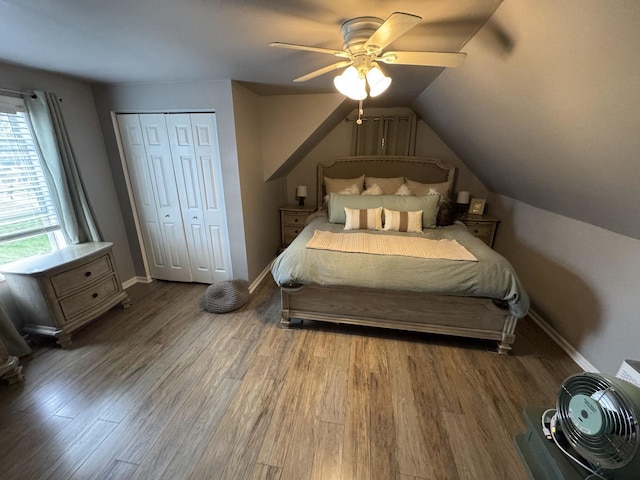 800 Tomahawk Trl, Round Lake Heights, IL 60073 - bedroom featuring vaulted ceiling, baseboards, wood finished floors, a closet, and ceiling fan
