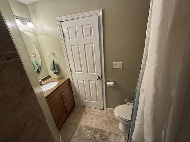 800 Tomahawk Trl, Round Lake Heights, IL 60073 - full bathroom with toilet, vanity, tile patterned floors, and baseboards