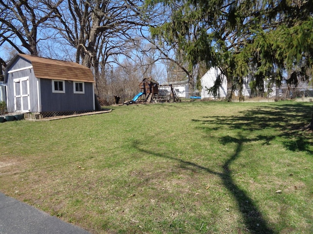 800 Tomahawk Trl, Round Lake Heights, IL 60073 - view of yard with a shed, an outdoor structure, a playground, and fence