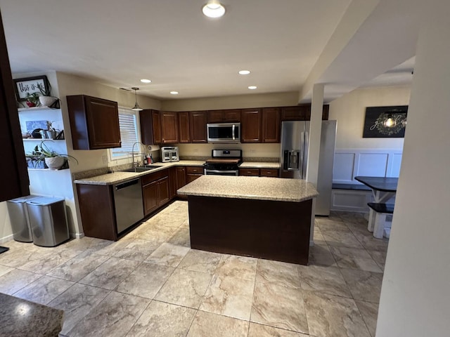 800 Tomahawk Trl, Round Lake Heights, IL 60073 - kitchen with stainless steel appliances, dark brown cabinetry, a center island, and a sink