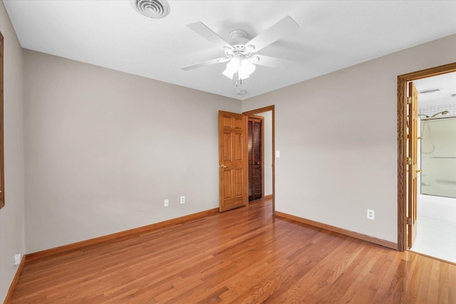unfurnished room with light wood-type flooring, baseboards, and ceiling fan