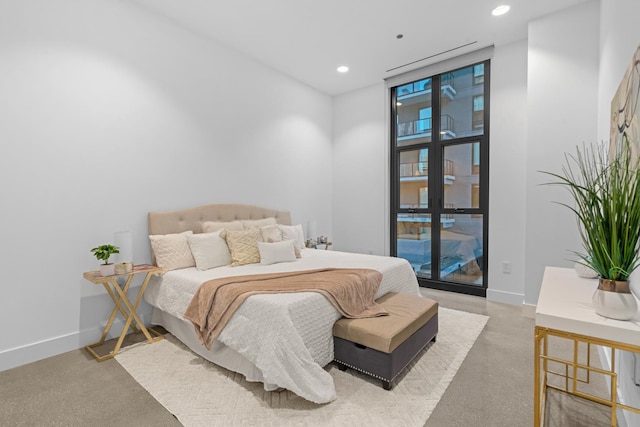 bedroom featuring baseboards and recessed lighting