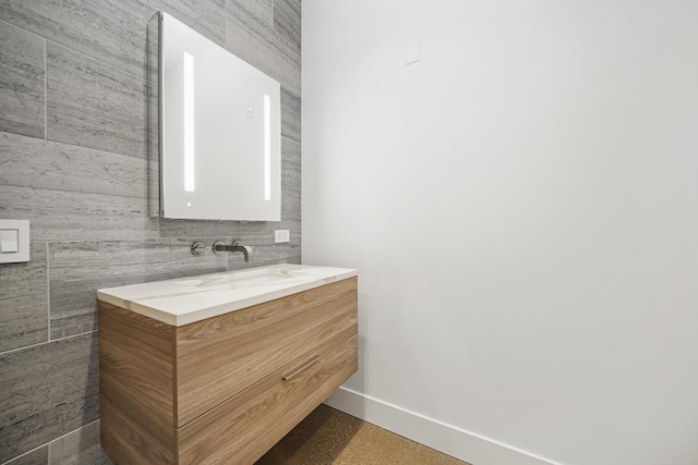 bathroom featuring vanity and baseboards