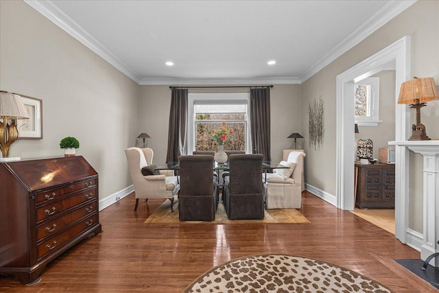 dining space featuring recessed lighting, wood finished floors, baseboards, and ornamental molding