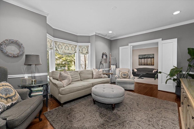 living area with recessed lighting, ornamental molding, and dark wood-style flooring