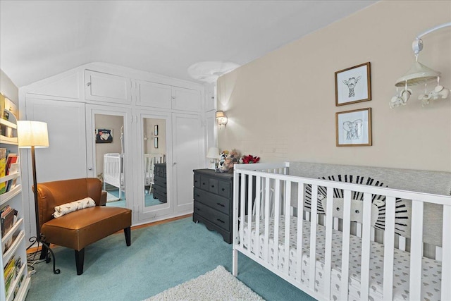 bedroom featuring vaulted ceiling and carpet