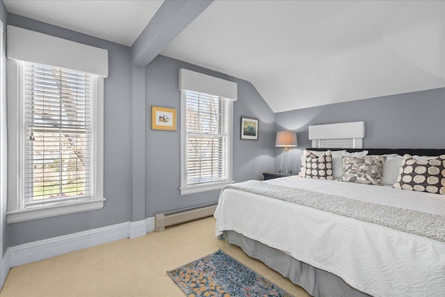 carpeted bedroom featuring baseboard heating, baseboards, and vaulted ceiling