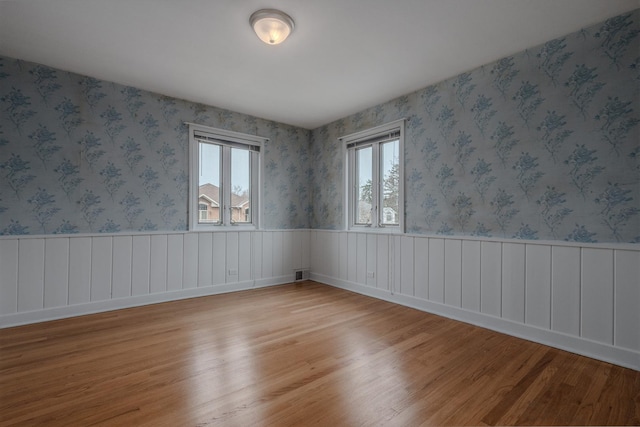 spare room featuring light wood-style floors