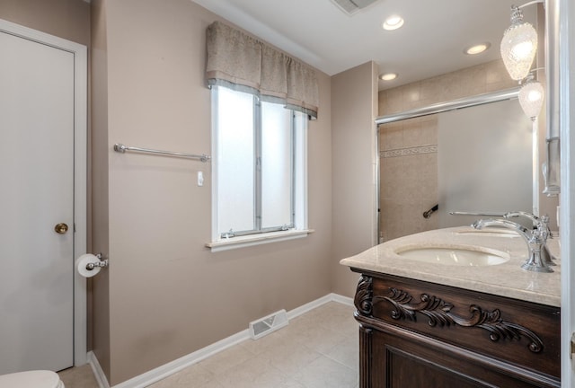 bathroom with baseboards, an enclosed shower, visible vents, and recessed lighting