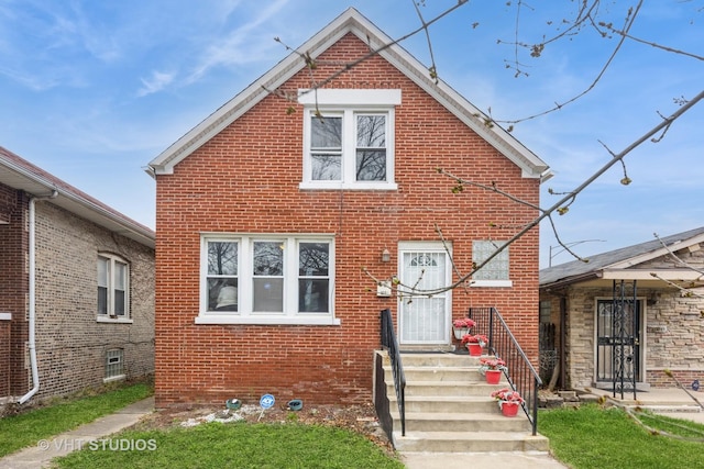 traditional-style house featuring brick siding
