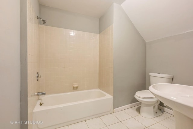 full bathroom featuring toilet, baseboards, tile patterned floors, and  shower combination
