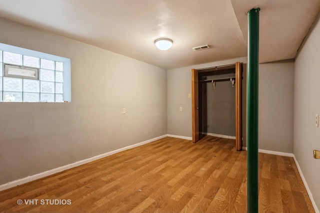 unfurnished bedroom with baseboards, visible vents, and light wood-style flooring