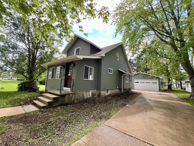209 S Chestnut St, Pesotum, IL 61863 - view of front facade featuring a front lawn, an outdoor structure, and a garage