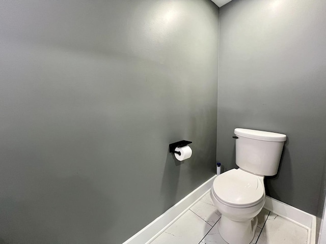 209 S Chestnut St, Pesotum, IL 61863 - bathroom with toilet, marble finish floor, and baseboards