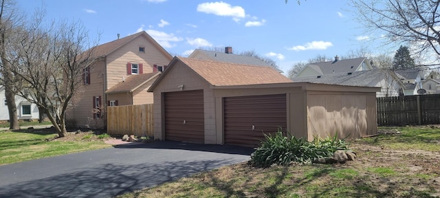 garage with fence