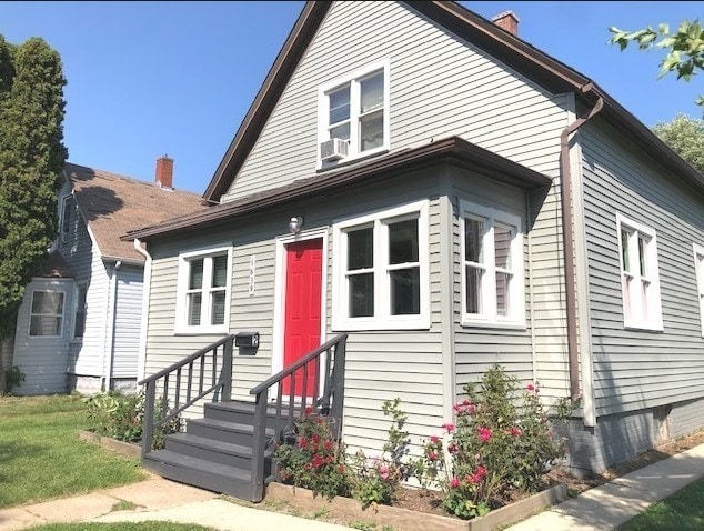 1639 Victoria Ave, North Chicago, IL 60064 - bungalow-style home featuring entry steps and a chimney